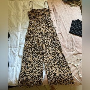 Forever 21 animal print jumpsuit. Strappy back, very sexy!